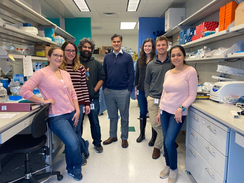 Dr. Parihar (middle) and his colleagues in the lab.