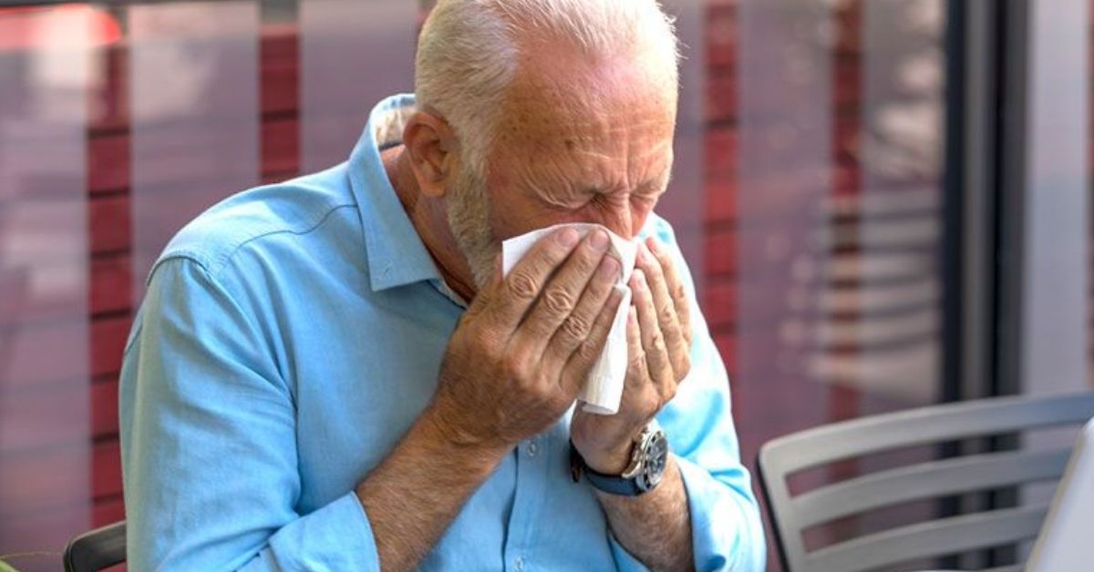 A man blowing his nose
