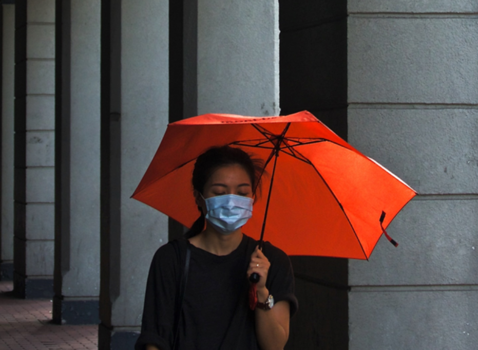 woman-wearing-face-mask-with-red-umbrella