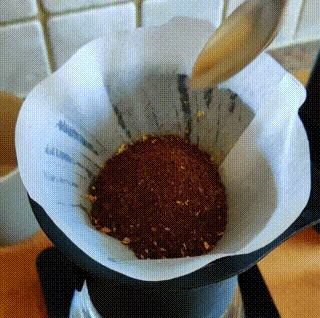 weigh your ground coffee into the V60 paper filter cone