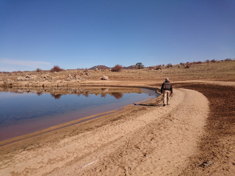 man fishing on lake jindabyne