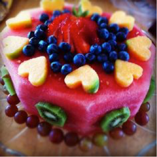 birthday cake made out of fresh fruit for boys and girls