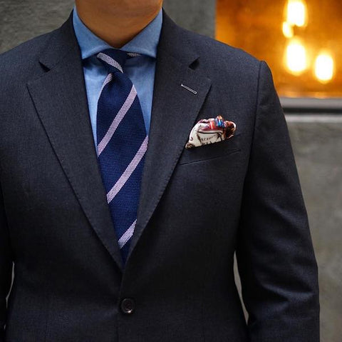 Navy blue striped tie and pocket square