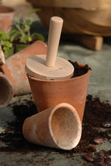 pot tamper- wooden in terracotta pots