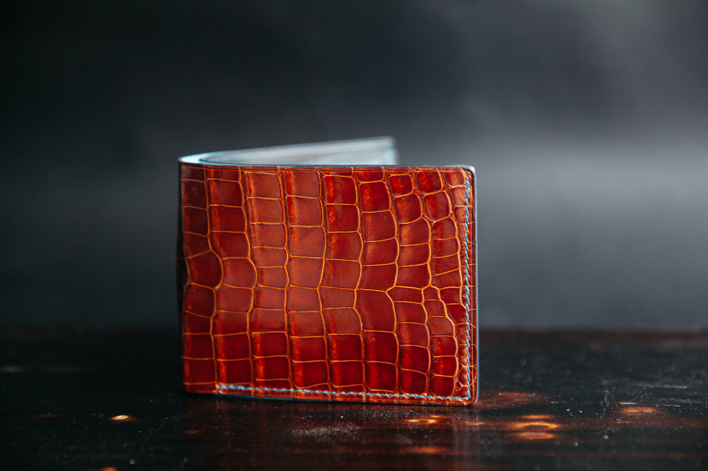 handmade luxury glazed peanut alligator skin bifold wallet with french chevré interior. handcrafted in nashville tn