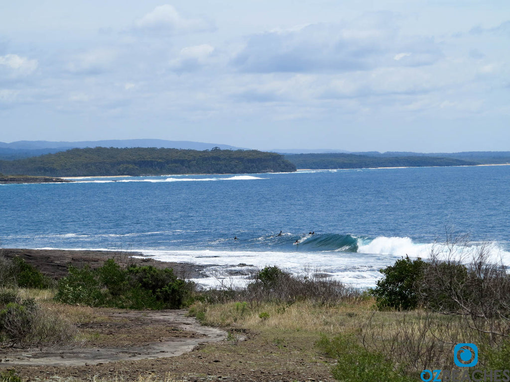 Surfers in the water at Guillotines, Bawley Point NSW