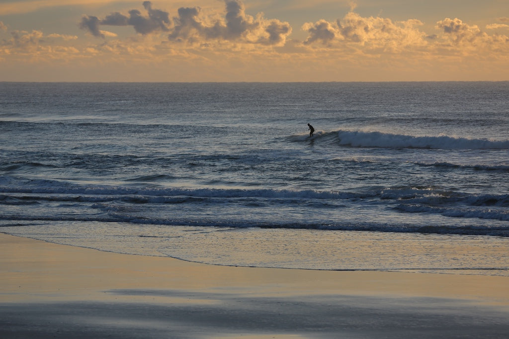 Lone surfer at Coolum Beach Sunshine Coast QLD