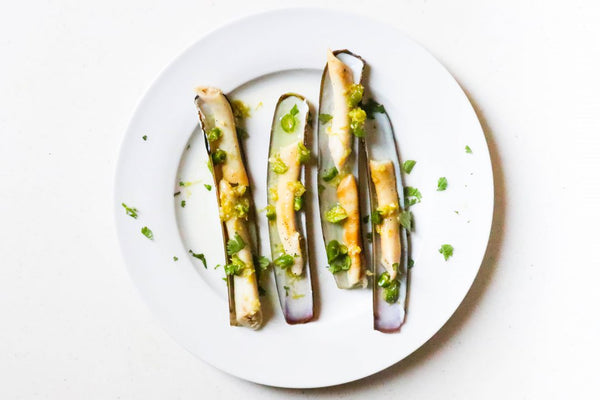 cooked razor clams on white plate