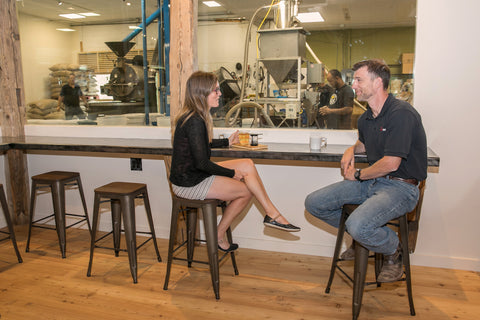 man and woman drinking coffee