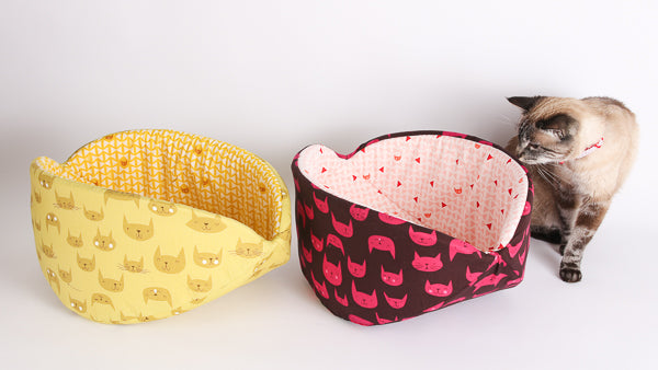 Two custom fabric Cat Canoe® pet beds, made in jumbo size