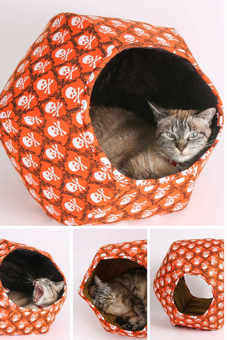 The Cat Ball cat bed in orange Skull and Crossbones fabric a Halloween pet bed