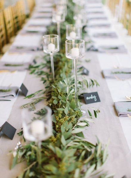 branches lying on table as wedding centerpiece