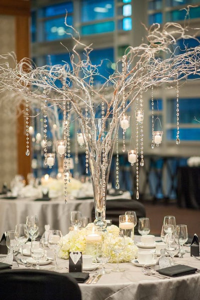 branches centerpiece with candles and crystals