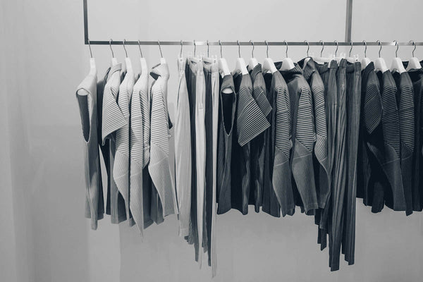 stylish clothes in a closet rack 