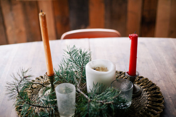 candles and plants mixed centerpiece