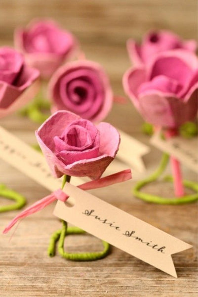 Paper roses are great for just about anything related to wedding decorations. Try them for escort cards.