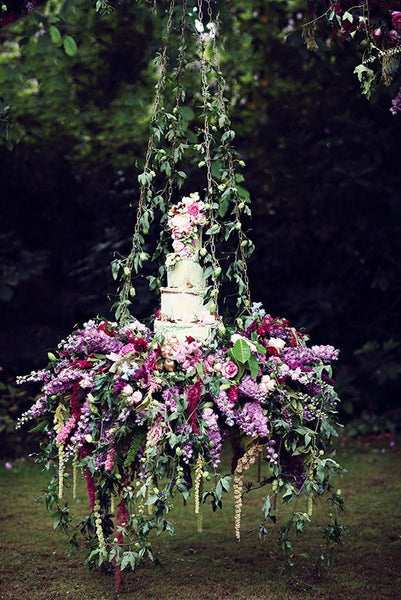 Instead of a traditional cake table, use a swing to hold your wedding cake.