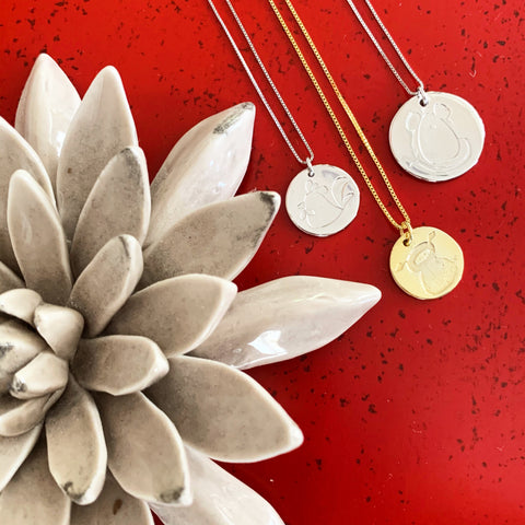 Chinese New Year Necklaces on red table with ceramic succulent 