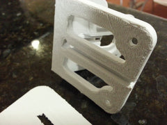 The raft has a solid top, from which the printed object peels off relatively cleanly.