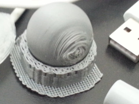 Our silver ABS on silver HIPS.  The bottom of the sphere was built on top of the HIPS support, instead of on a ABS base.  Sliced with KISSlicer. Printed on Replicator Dual