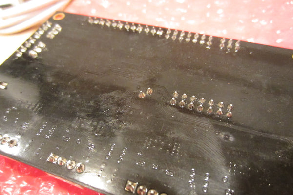  Residue on the PCB.  You can see finger print smudges.