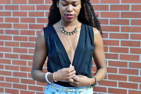 statement necklace layering with body chain