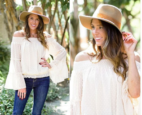 white boho top with jeans and floppy hat