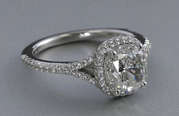 cushion cut engagement ring with diamond halo
