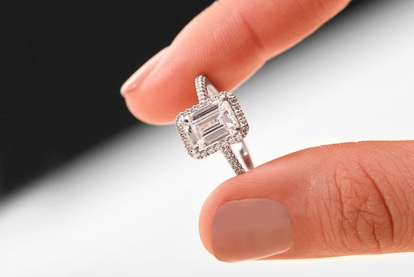 emerald cut engagement ring with a diamond halo