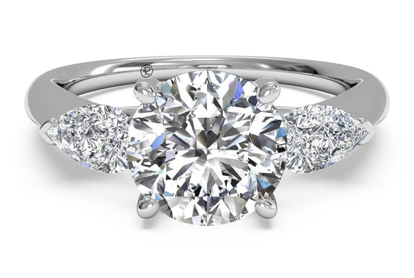 Engagement ring with pear-shaped sidestones