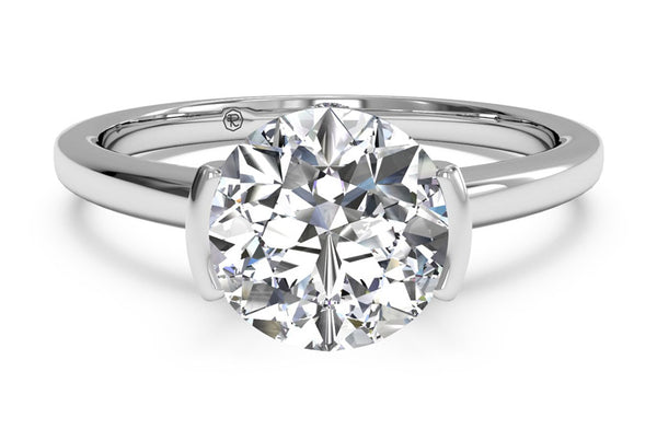White gold semi-bezel solitaire engagement ring with a round cut diamond 
