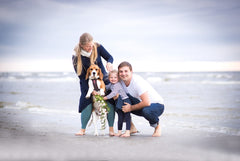 family photo on the beach with dog