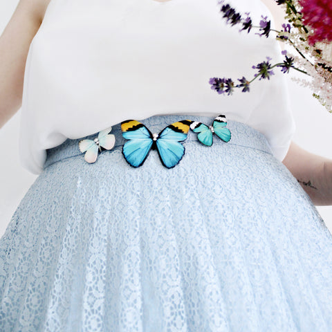 Butterfly brooch worn on a skirt.