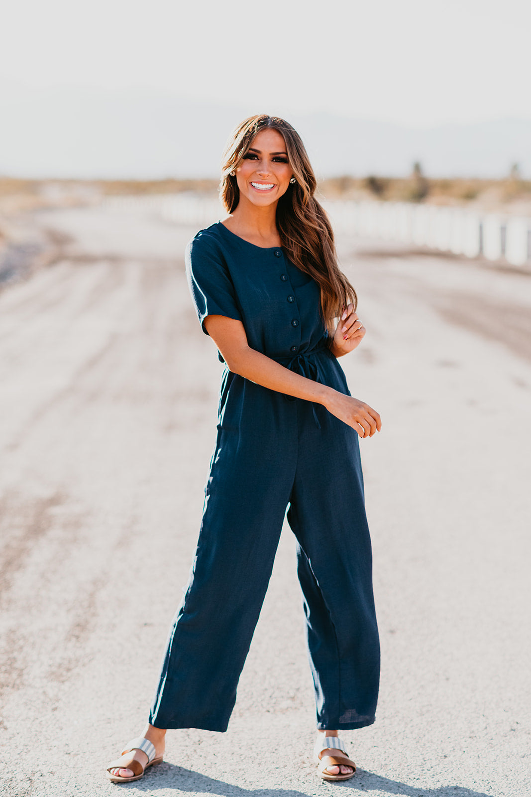 THE REAGYN BUTTON DOWN JUMPSUIT IN NAVY