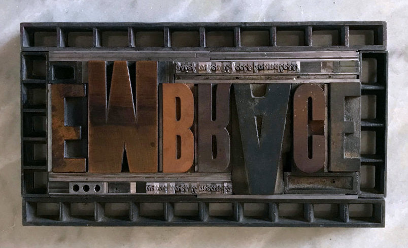 metal and wood type form for Embrace