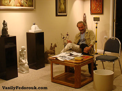 Vasily with dog Era at his home gallery outside of Chicago