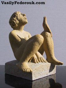 Ceramic Sculpture of young man looking up to sky bird on his knee also looking up