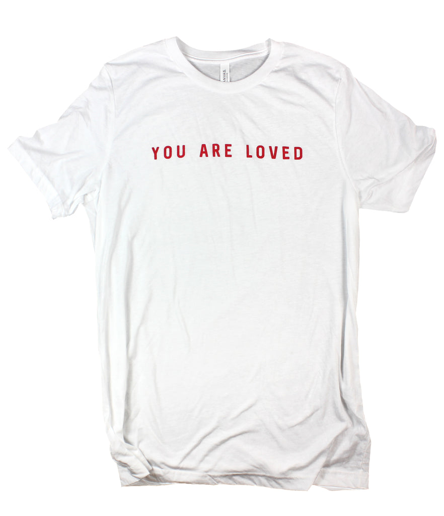 white t shirt with red writing