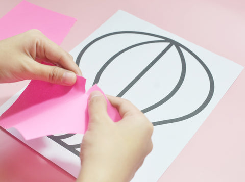 Get one half-sized colored paper and prepare to tear it. You may tear the colored paper into half first. Continue tearing until you make pieces of paper on all the colors.