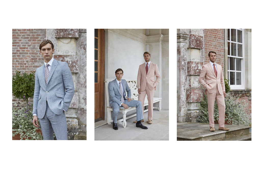 Two male models wearing pastel blue and pink linen suiting by Favourbrook.