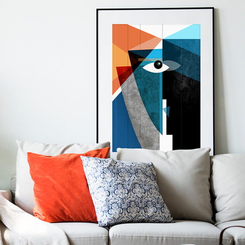 Abstract painting hanging behind a couch