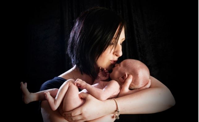 Julia as a newborn with William