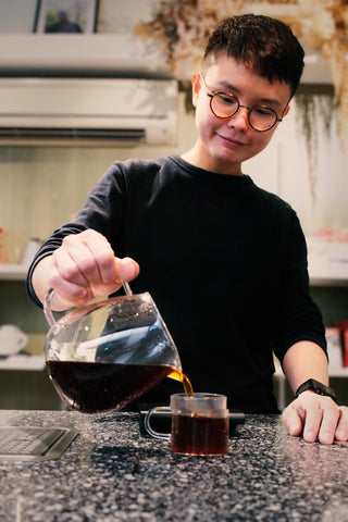 Barista Voon from Chye Seng Huat Hardware pouring a cup of coffee.