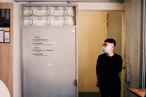 Barista Voon standing in front of a doorway in Chye Seng Huat Hardward