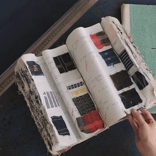 animation of hand flipping through a swatch book