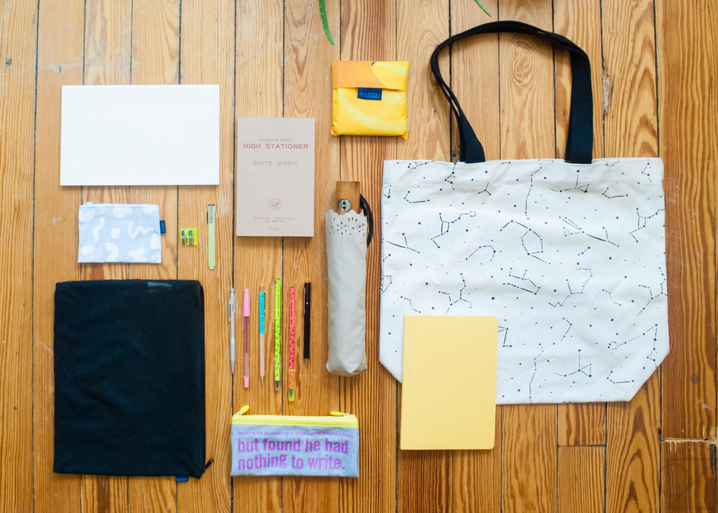 packing light for a day's errands with notebooks and tote