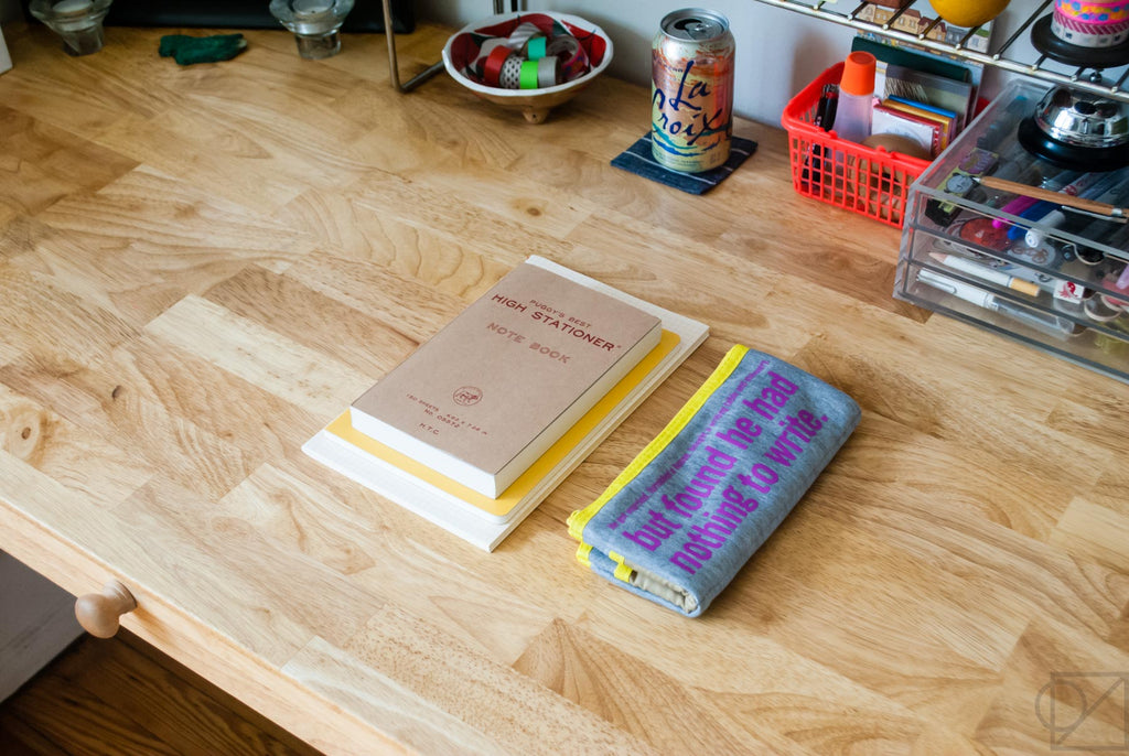 a short stack of my favorite japanese notebooks with pencil case