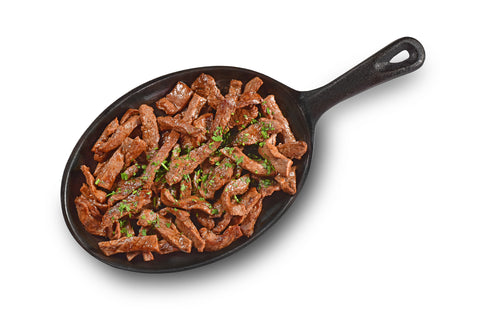 Steak fajita in a cast iron frying pan