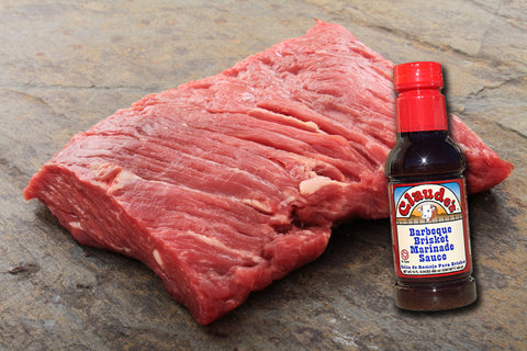 Claude's Sauces BBQ Brisket Marinade with a side of brisket