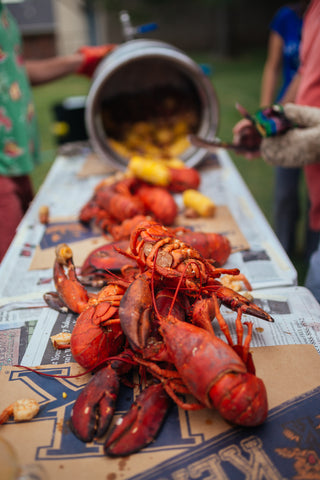 Seafood boil on a table covered in newsprint